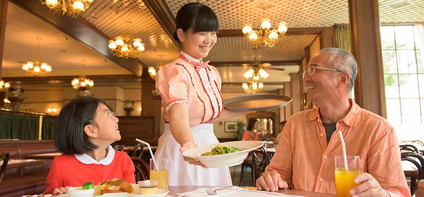 A waitress serving customers at Eastside cafe