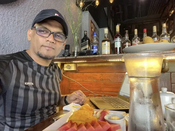 Man eating breakfast from a hotel buffet