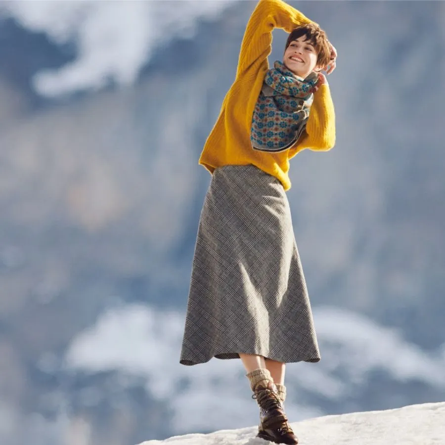 Woman in winter clothing on a mountain
