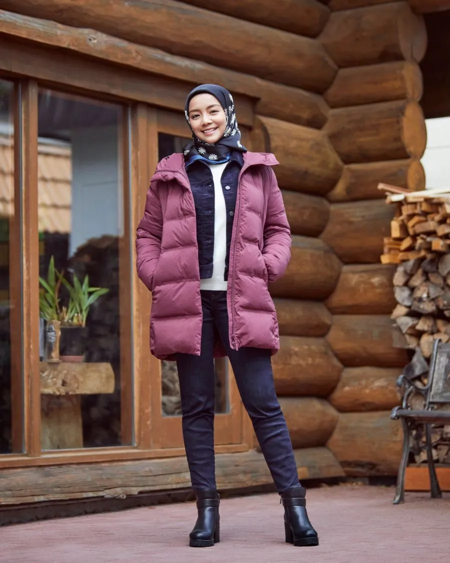 A Muslim woman in a padded jacket