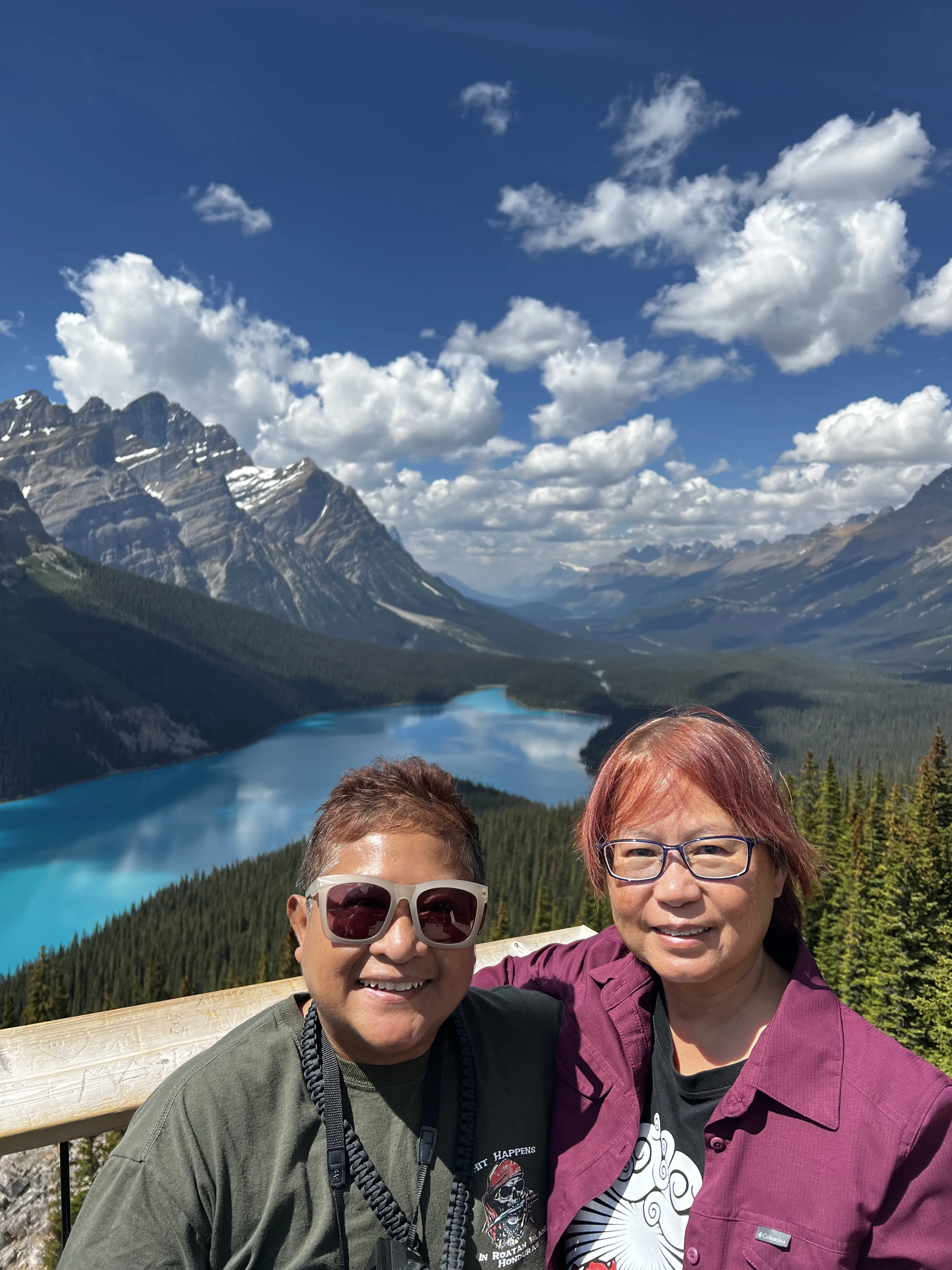 Two women infront of a valley
