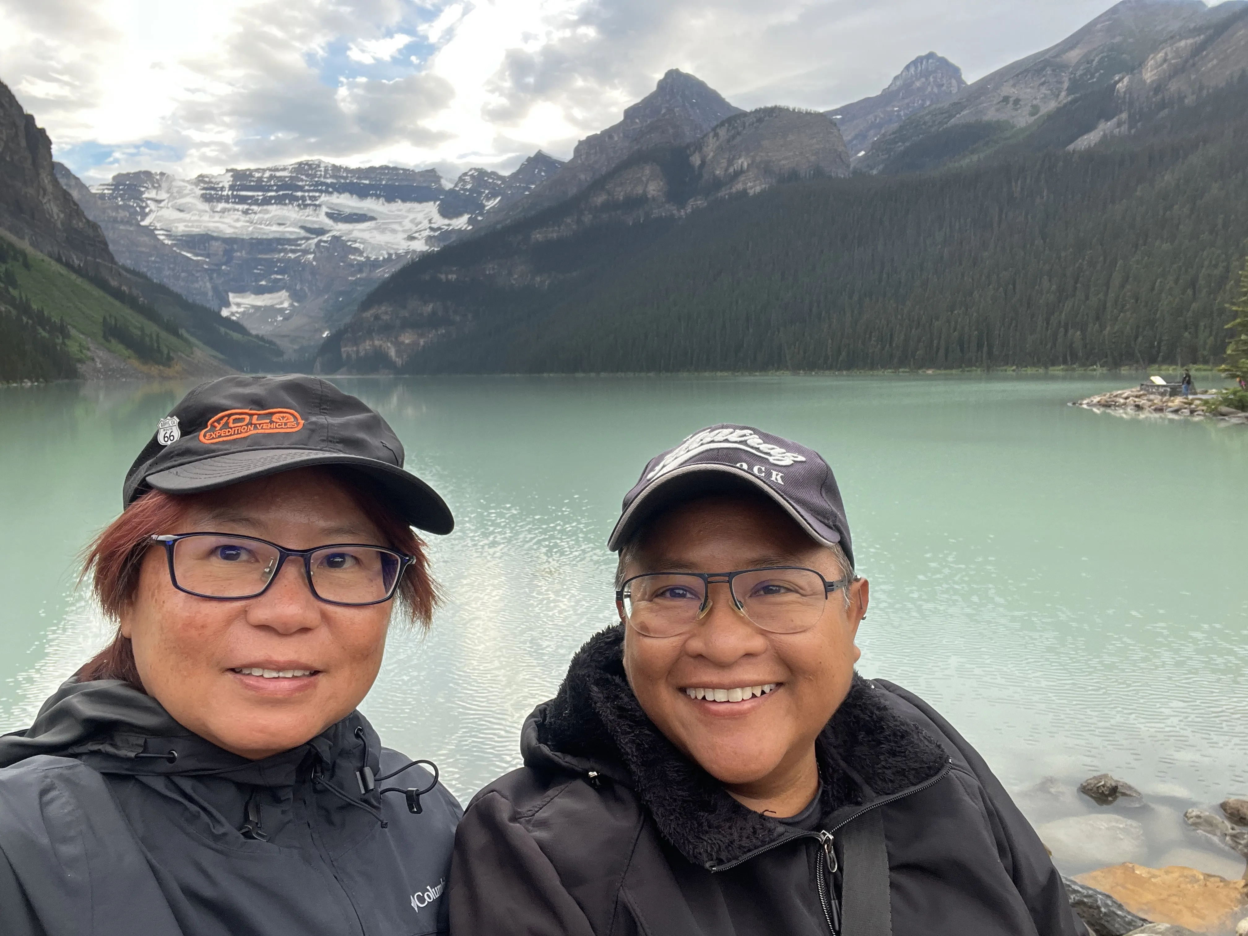 Two women infront of mountains