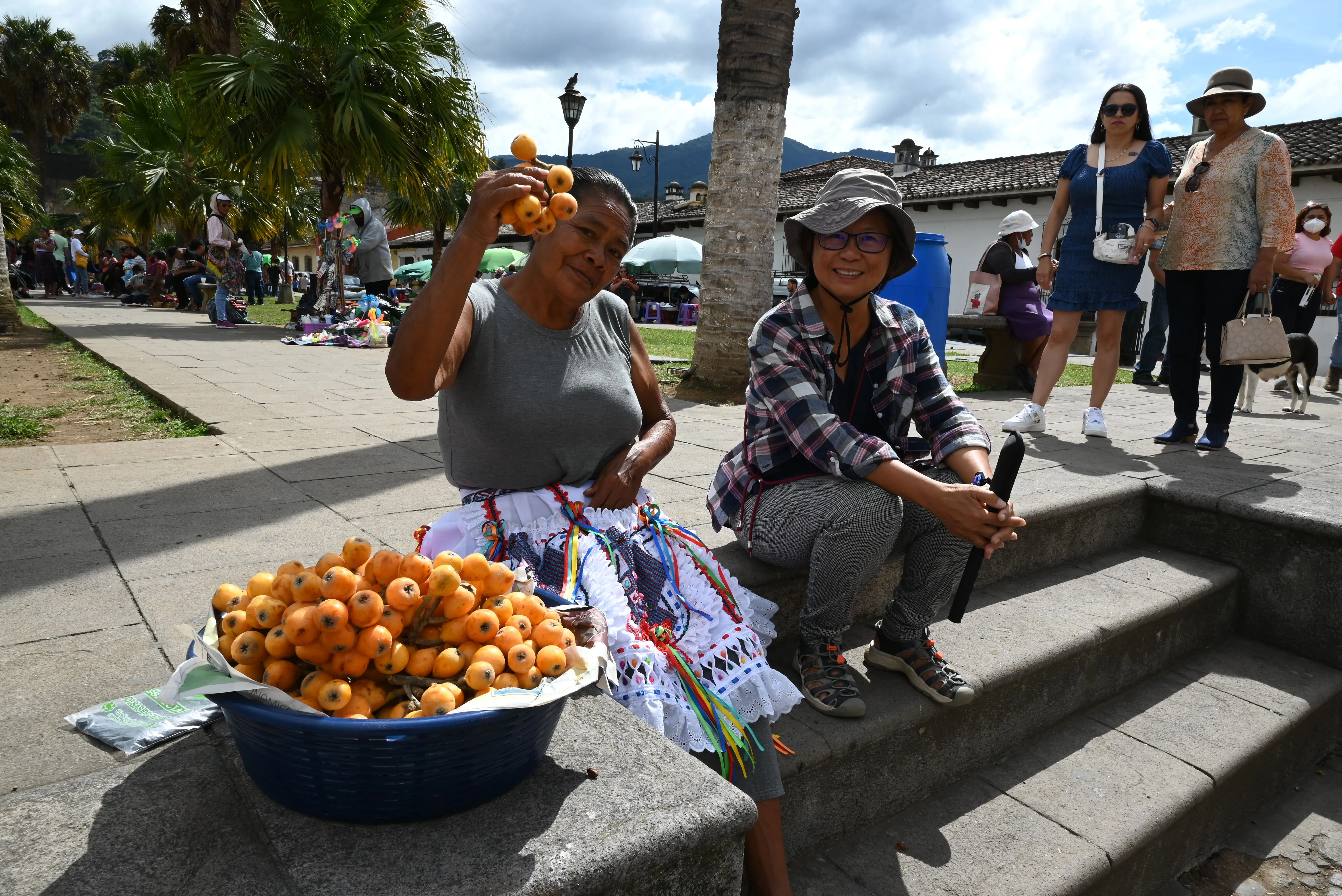 A woman posing with a local street vendor