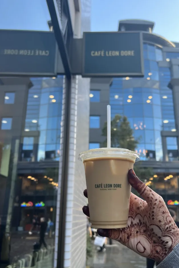 Someone holding a cup of coffee