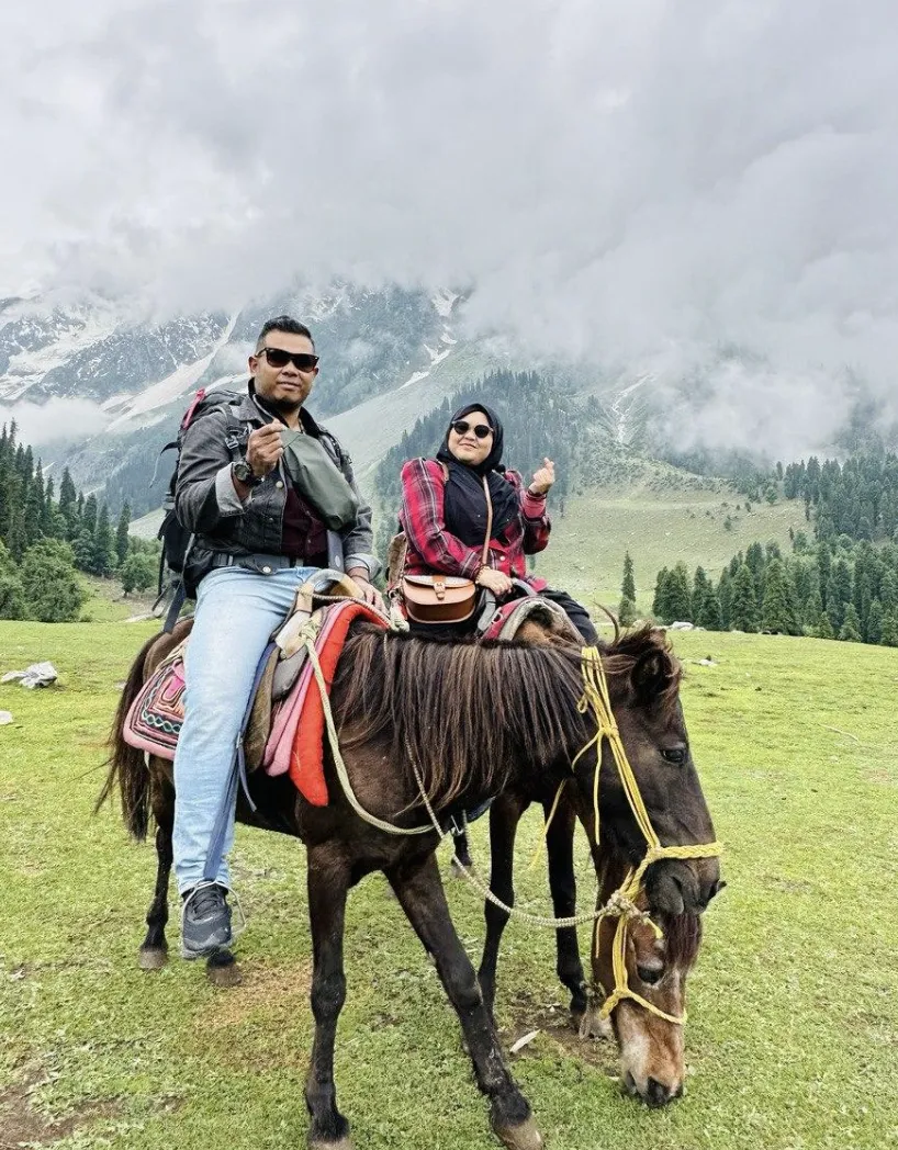 Two people on two ponies going for a ride