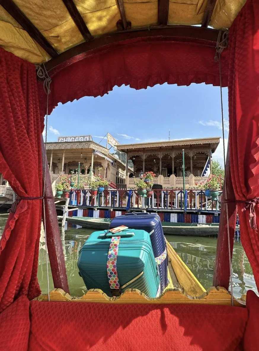 A boat ride on the way to the houseboat with luggages on the boat