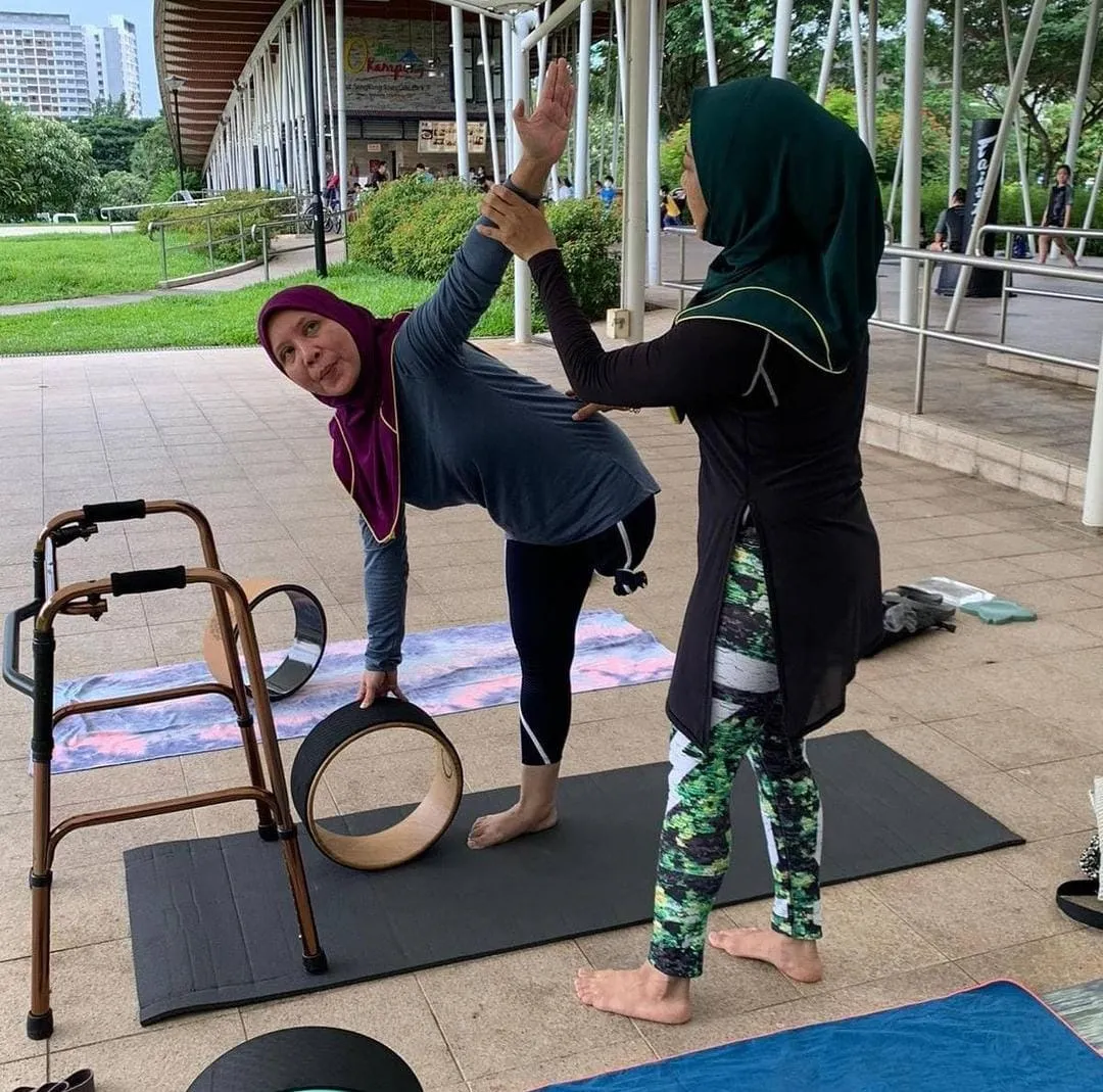 yoga class with a teacher and a student